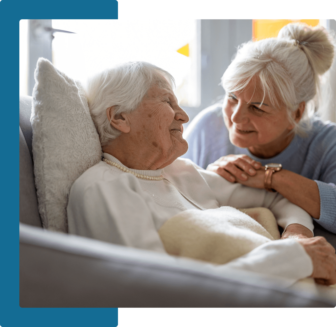 Group 18 A woman is holding the arm of an older person.