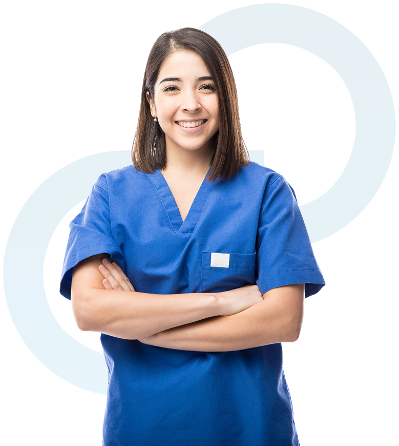 Group 4 A woman in blue scrubs with arms crossed.