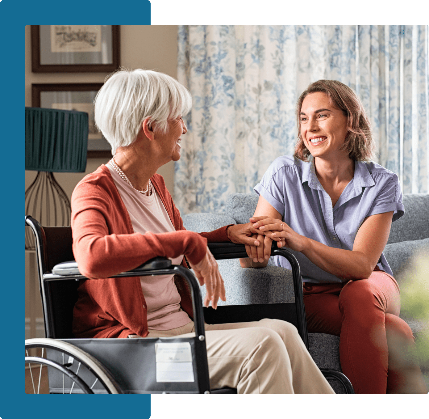 Group 6 A woman sitting on the lap of an older lady in a wheelchair.
