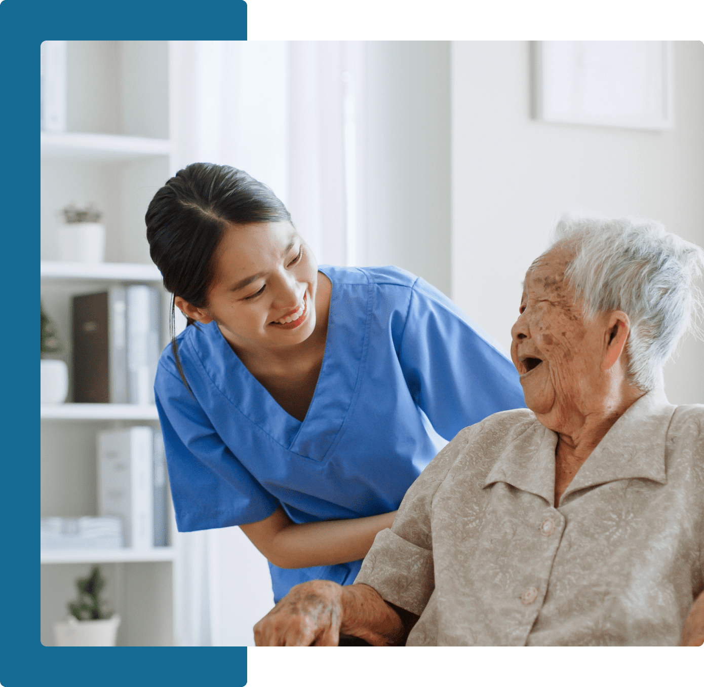 Group 8 A nurse is helping an elderly woman in a wheelchair.